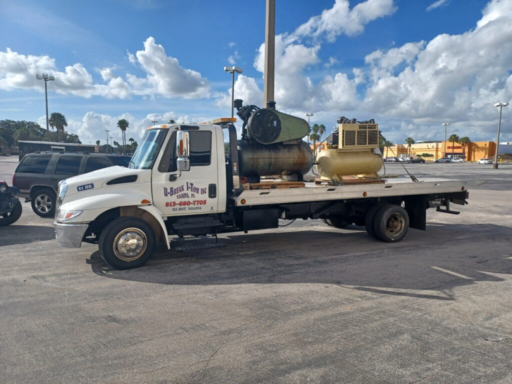 Machinery towed on a towing truck