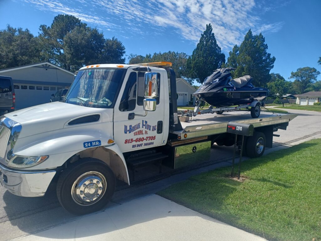 A jet ski towed on a towing truck