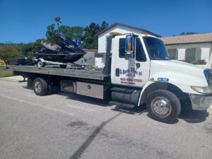 A jet ski towed on a towing truck