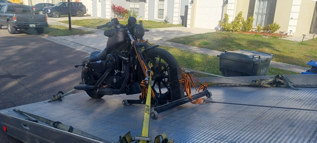 Motorcycle towed on a tow truck