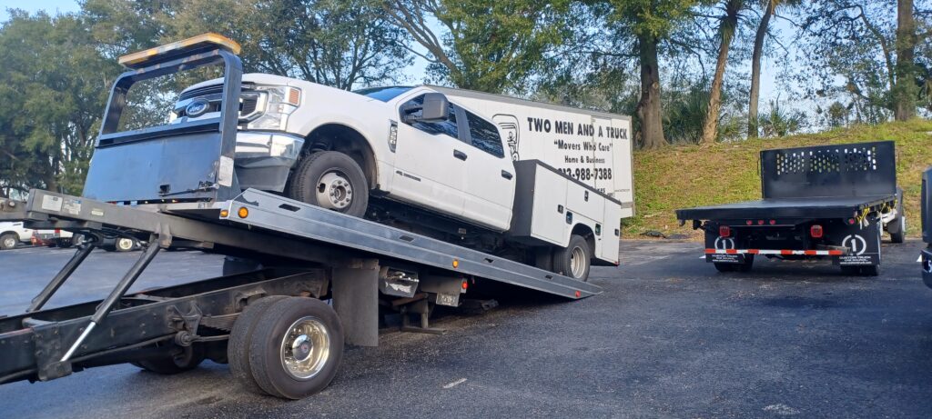 A pick up truck being towed
