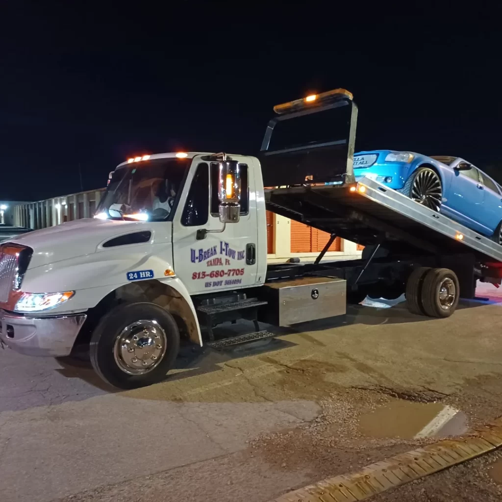a blue car being towed